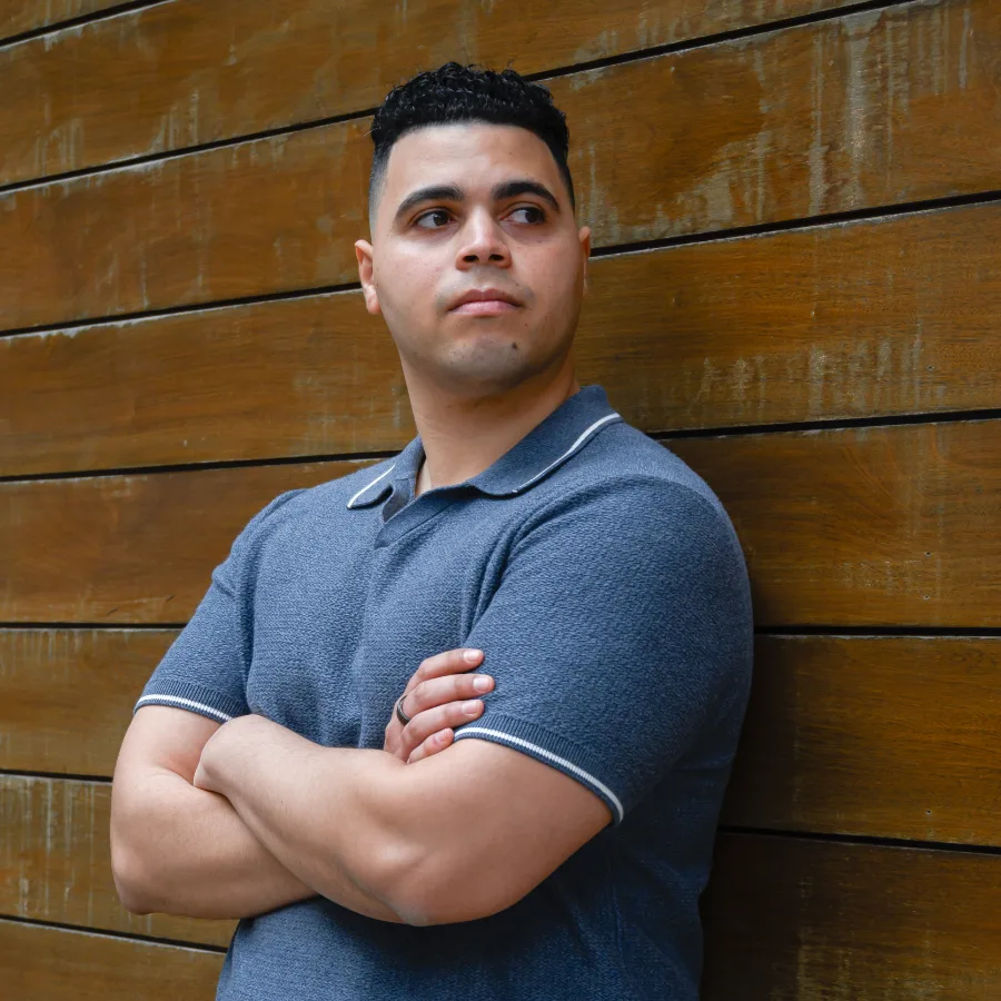 Victor - Portrait against a horizontal wood wall, looking away